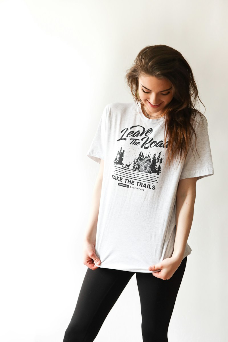 Happy customer wearing essential tee